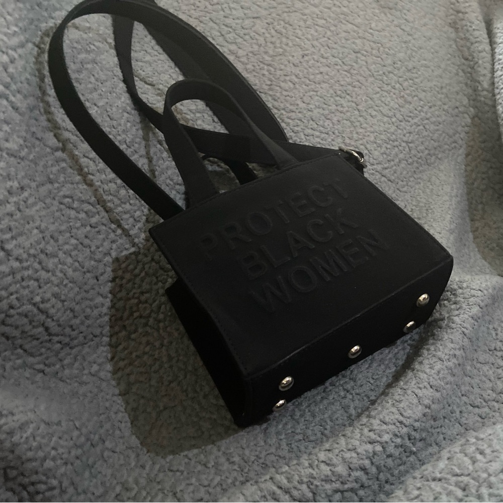 Cise Protect Black Women mini-tote. Great statement piece or for evedyday wear.